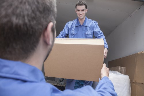 Moving team handling furniture safely for a Man With Van Eltham service