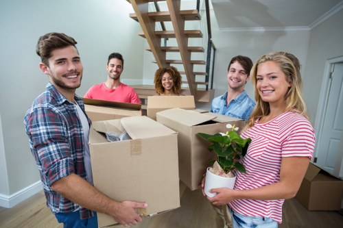 Moving team loading household items in Eltham outside a residential property