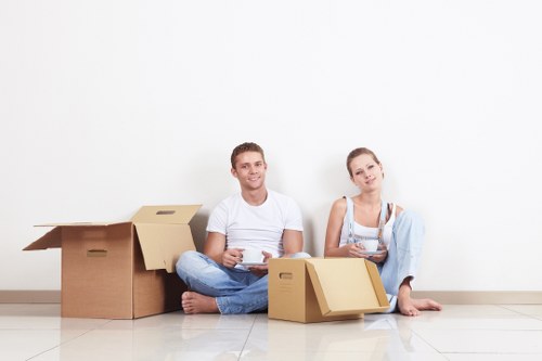 Moving team unloading boxes and furniture at a new home