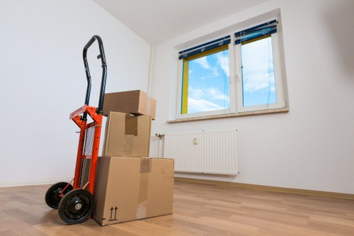 Removal van and movers handling household furniture in Eltham