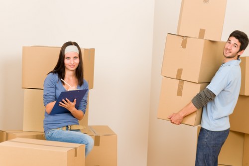 Removal crew carrying household items through a residential property